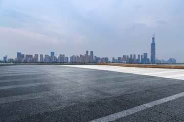 Panoramic skyline and modern business office buildings with empty road,empty concrete square floor