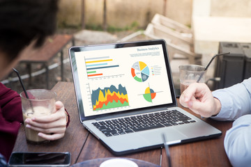 Business people using laptop analyzing statistics data on laptop screen, working with graphs charts online at meeting. Business analysis concept. - obrazy, fototapety, plakaty