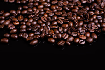 a lot of coffee beans on black ground