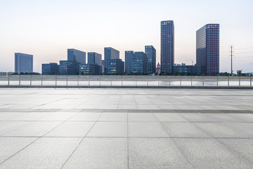 Panoramic skyline and modern business office buildings with empty road,empty concrete square floor