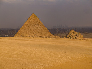 Fototapeta na wymiar Pyramids of Cairo with the city in the background