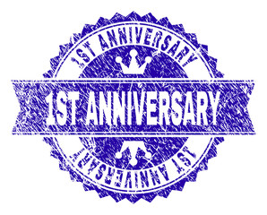 1ST ANNIVERSARY rosette stamp watermark with distress style. Designed with round rosette, ribbon and small crowns. Blue vector rubber watermark of 1ST ANNIVERSARY label with unclean texture.