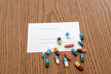 Fototapeta na wymiar prescription with colorful pills