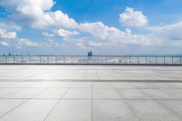 Obraz premium Panoramic skyline and modern business office buildings with empty road,empty concrete square floor