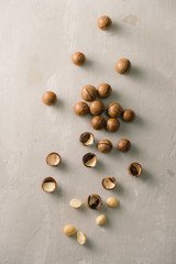 Superfood. Organic macadamia nut on stone background.