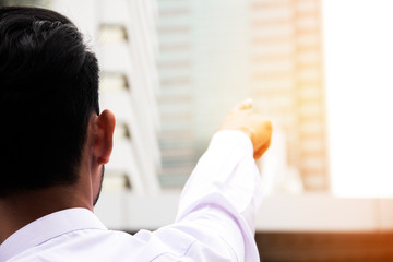 Fototapeta premium Business man pointing finger in office building. business concept.
