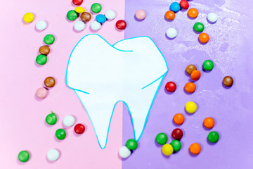 toothbrushes and a toothpaste on a colorful background