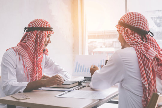 Two Arab Business People Working Together In An Office Business Project.