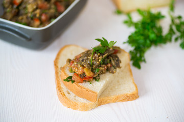 eggplant caviar with tomatoes and a slice of bread