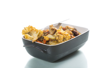 Cauliflower baked with mushrooms and eggplants in ceramic form