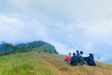 group of tourist sitting on the top of mountain at Doi Mon Jong, Chiang Mai, Thailand