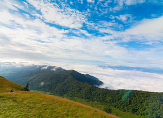 Fototapeta na wymiar photographer take a photo on the top of mountain at Doi Mon Jong, Chiang Mai, Thailand