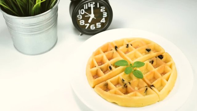 Delicious homemade waffles on a plate top view.