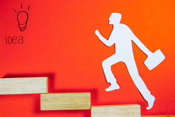 success concept - white man figure on a ladder