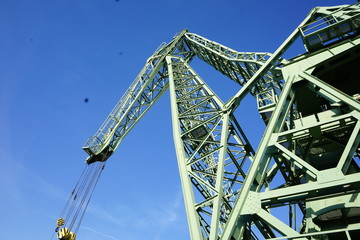 Industrial crane against blue sky