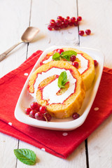 Cake with cream, fresh fruit and mint