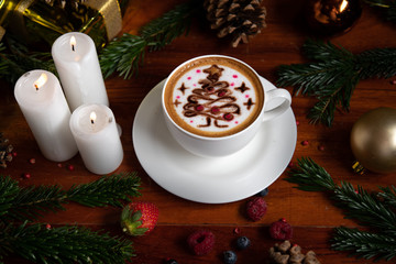 Cute cup of coffee, cafe late art Christmas tree and festive decoration