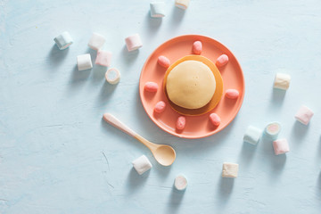 Children's breakfast or dessert - pancake with marshmallow candies.