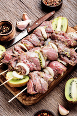 Raw beef shish kebab on skewers