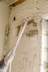 Worker Applying Gypsum Plaster To The Aerated Concrete Wall With A Spray Plastering Machine Internal Finishing In Procces Wall Mural Imray Worker Applying Gypsum Plaster To The Aerated Concrete Wall With A Spray Plastering Machine Internal Finishing In Procces Wall Mural Imray