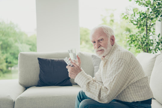 Profile Side View Portrait Of Sad Tired Stylish Old Man Sitting 