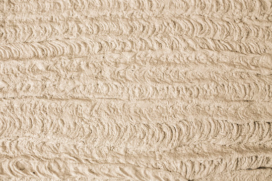 Texture Of Wet Gypsum Plaster Applying To The Aerated Concrete Wall With A Spray Plastering Machine. Plastering Structure Close-up. Internal Finishing Background.