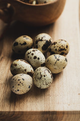 Quail eggs on wooden table 