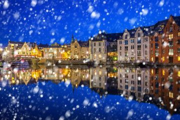 Fototapeta na wymiar Alesund town on a cold winter night with falling snow, Norway
