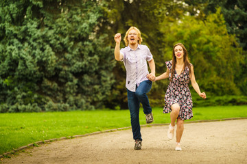 Naklejka premium Happy couple playing in park