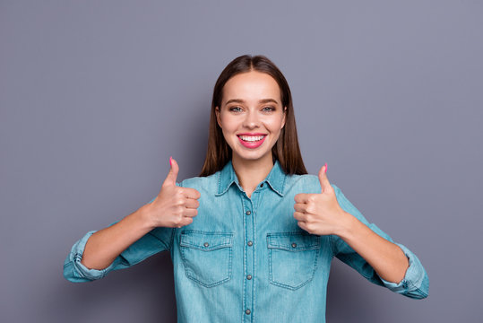 Glad grinning cheerful lady with her brunette hair she show thum