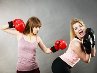 Agressive women fighting boxing with female