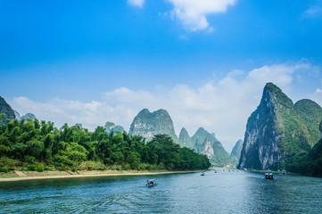 Beautiful mountains and river scenery with blue sky, Yangshuo, China. - obrazy, fototapety, plakaty