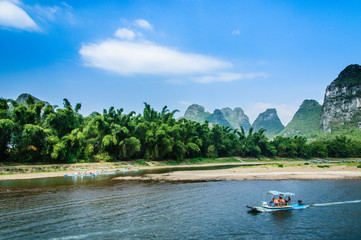 Fototapeta na wymiar Beautiful mountains and river scenery with blue sky, Yangshuo, China.