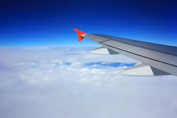 Fototapeta na wymiar Airplane wing in the sky