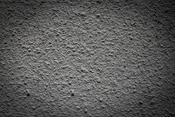 rough grey texture of the wall. small pimples