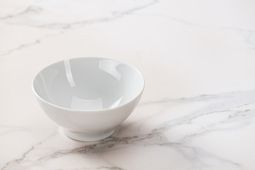 White bowl on marble