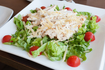 Beautifuly served chicken Caesar salad