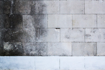 Grey gradient facing stone wall background with white copyspace