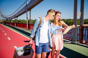 Carefree careless married charming cool hipsters hold use paper 