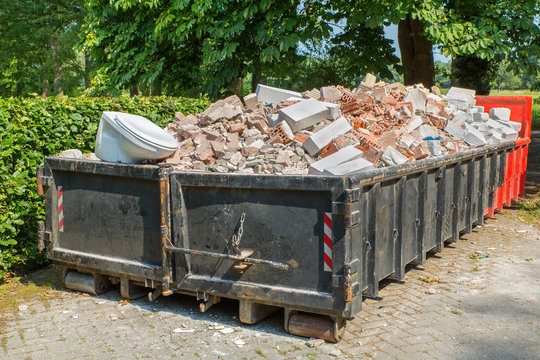 Debris container with stones and toilet