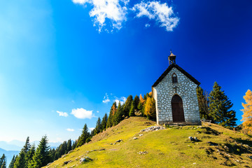 The Madonna della neve church in a colorful autumn