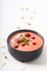 Healthy food by color of 2019 Yogurt Breakfast Bowl  with coconut, almond, flax seeds, Granola, and red currants in ceramic bowl with copy space