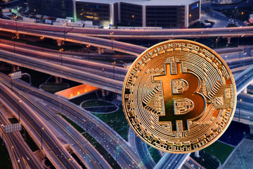 bitcoin against skyscrapers - futuristic smart city - cryptocurrency concept