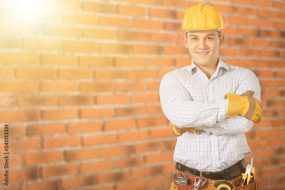 Wall mural Worker with a tool belt. Isolated over  background.