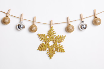 Fototapeta premium Christmas Decoration Hanging with Robe on White Background.Flat Lay,Top View