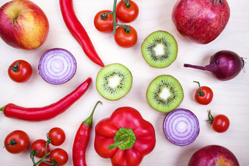 Ingredients with raw red vegetables and fruits