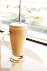 Hot coffee in a tall glass