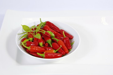 Red chili on paper white background