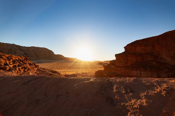 Fototapeta na wymiar Amazing Sunset on Red Desert Wadi Rum in Jordan