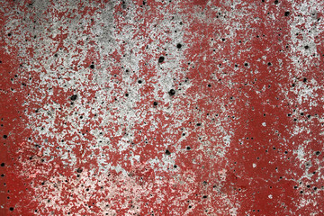 rough texture of a old gray wall with red paint